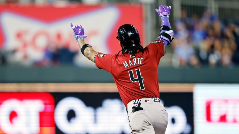 Arizona Diamondbacks' Ketel Marte celebrates hitting a three-run home during...