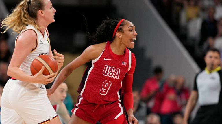 A'ja Wilson (9), of the United States, celebrates in front...