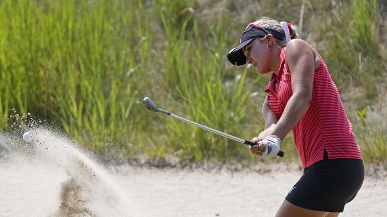 Lexi Thompson hits from the sand on the 12th hole...