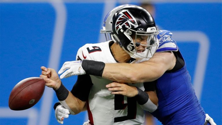 Atlanta Falcons quarterback Desmond Ridder (9) fumbles as he is...