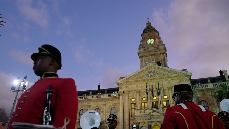 Band members await the arrival of South African President Cyril...