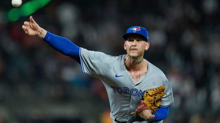 Toronto Blue Jays pitcher Bowden Francis throws to a San...