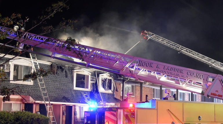 Several fire departments respond to a blaze at the Amityville...