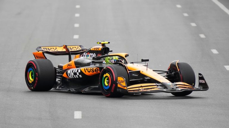 McLaren driver Lando Norris of Britain in action during a...