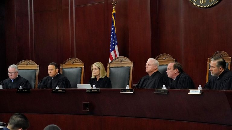 Arizona Supreme Court Justices, from left, William G. Montgomery, John...