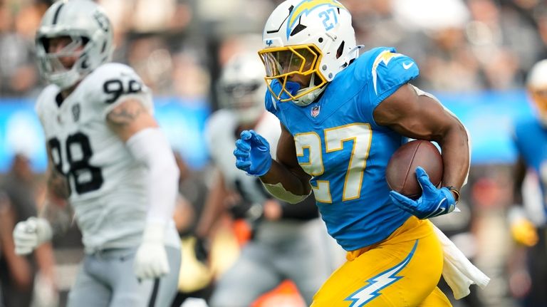 Los Angeles Chargers running back J.K. Dobbins (27) runs against...