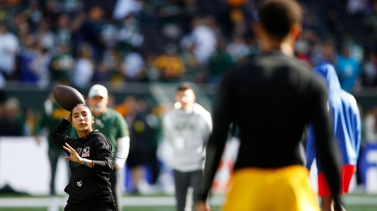 Team Mexico Women's Flag quarterback Diana Flores plays catch with...