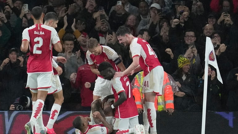 Arsenal's Gabriel Jesus, bottom, celebrates after scoring during their Group...