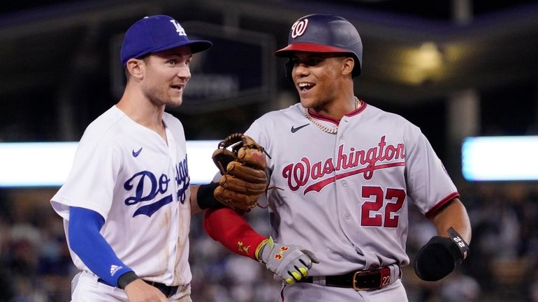 Los Angeles Dodgers' Trea Turner, left, and Washington Nationals' Juan...