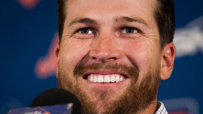 Mets pitcher Jacob deGrom smiles during a news conference Wednesday in...