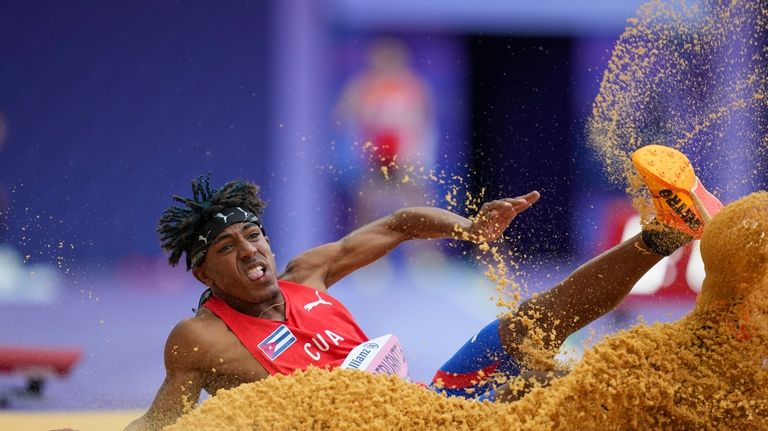 Cuba's Robiel Yankiel Sol Cervantes competes at the men's long...