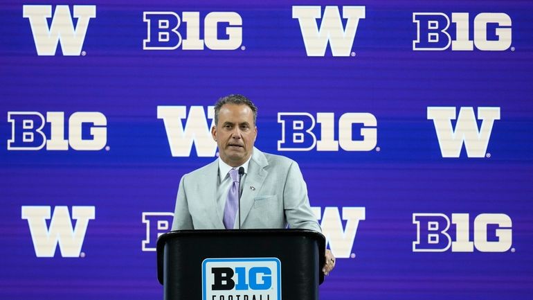 Washington head coach Jedd Fisch speaks during an NCAA college...