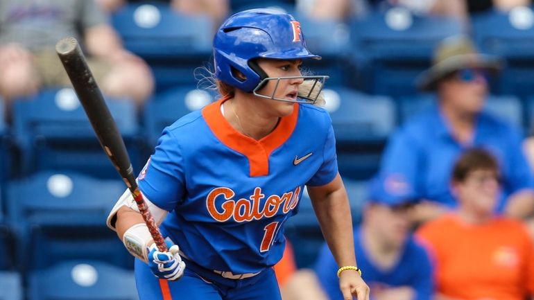 Florida's Amanda Lorenz hits a lead-off single in the first...