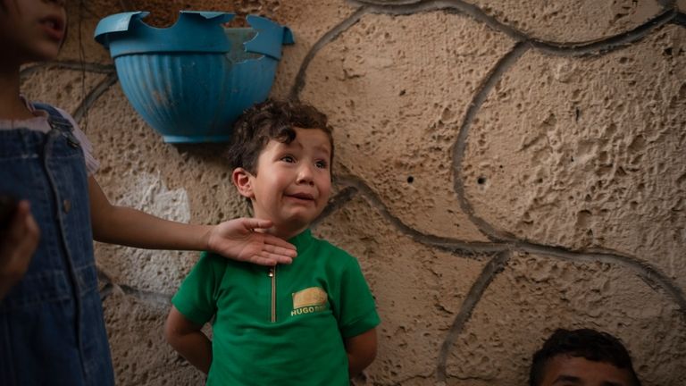 Youssef, 3, cries for his uncle Odei, who was killed...