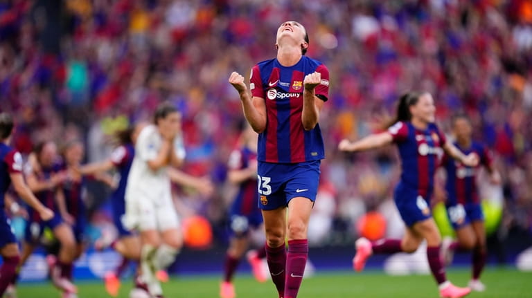 Barcelona's Ingrid Syrstad Engen celebrates after winning the women's Champions...