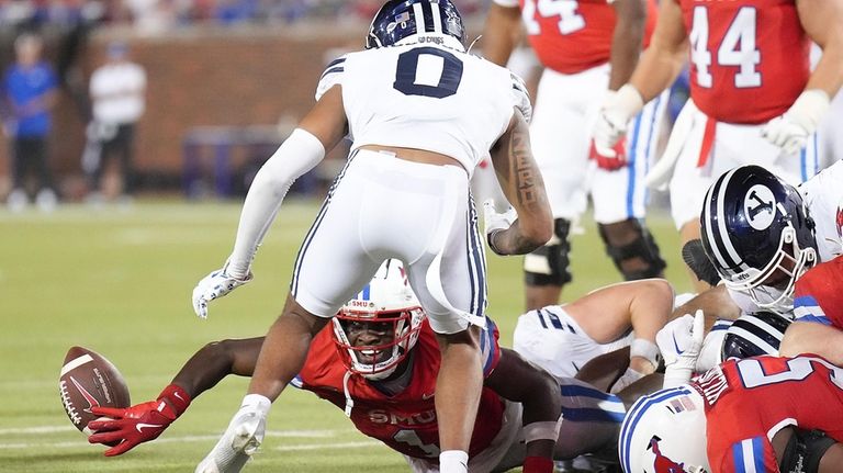 SMU running back Brashard Smith (1) fumbles the ball during...