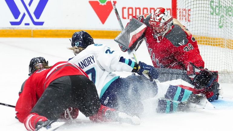 Ottawa's Jincy Roese (71) and New York's Jade Downie-Landry (27)...