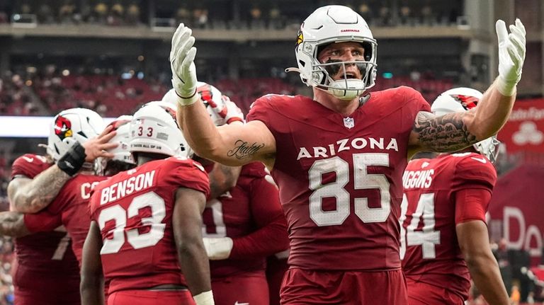 Arizona Cardinals tight end Trey McBride (85) celebrates the touchdown...