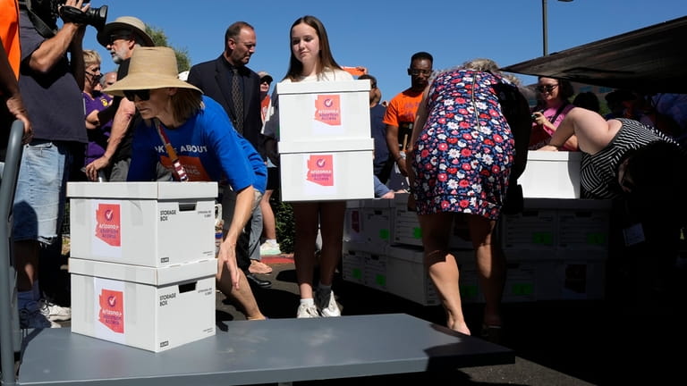 Arizona abortion-rights supporters deliver over 800,000 petition signatures to the...