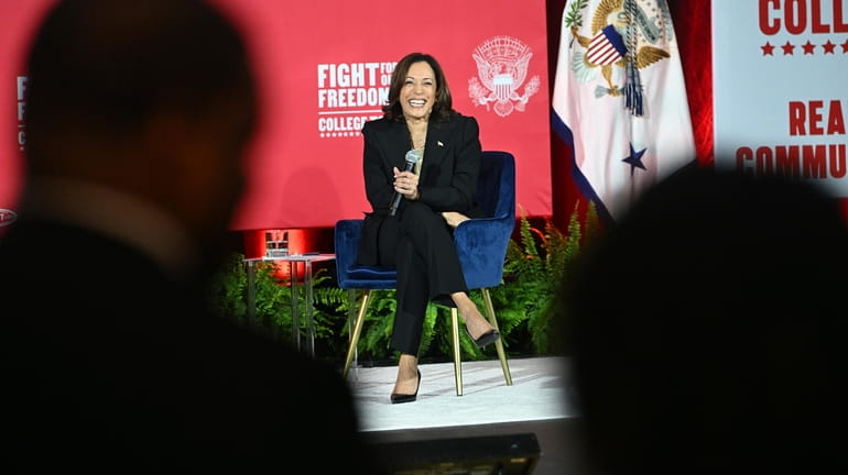 Vice President Kamala Harris listens to a question about climate...