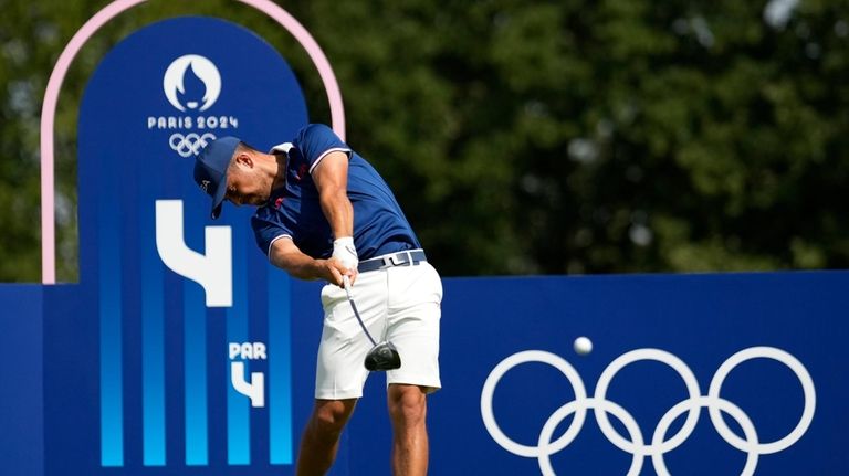 Xander Schauffele, of the United States, hits from the fourth...