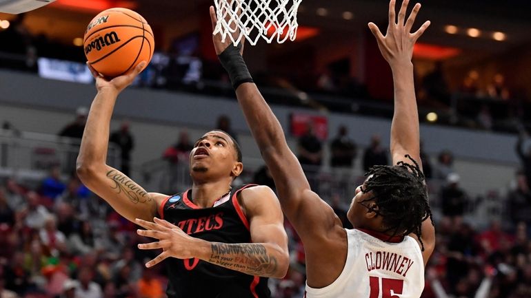 San Diego State forward Keshad Johnson (0) shoots against Alabama...