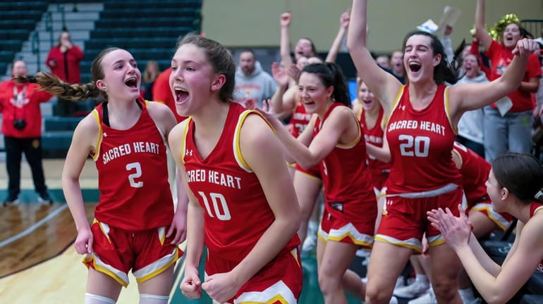Sacred Heart players celebrate their win over St. Mary's for the CHSAA...