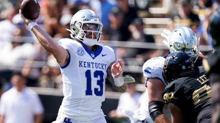 Kentucky quarterback Devin Leary (13) throws a pass against Vanderbilt...