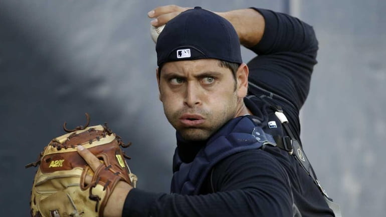 Yankees catcher Francisco Cervelli works on a throwing drill during...