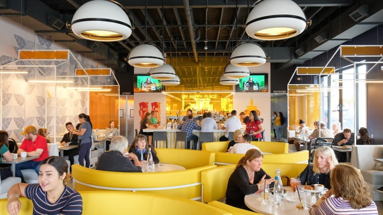 Large, cozy circular booths offer seating in the middle of...