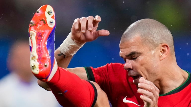 Portugal's Pepe kicks the ball during a Group F match...