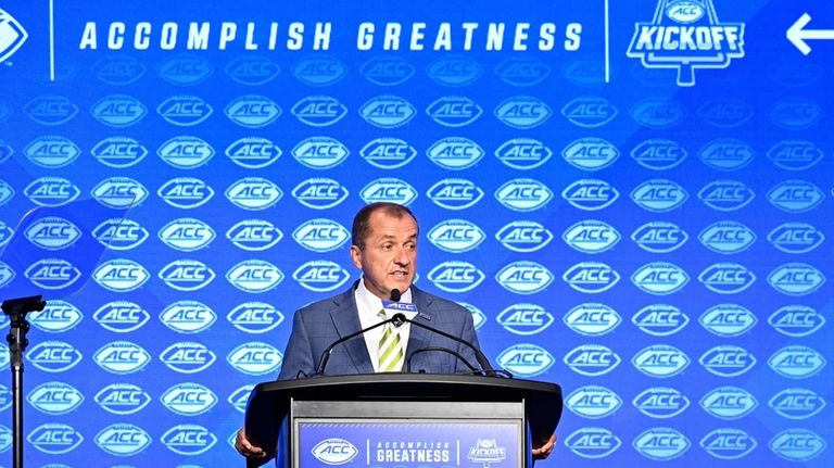 Atlantic Coast Conference commissioner Jim Phillips speaks during an NCAA...