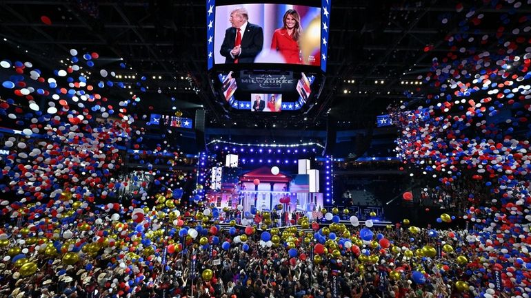 Balloons drop from the ceiling on the last night of...