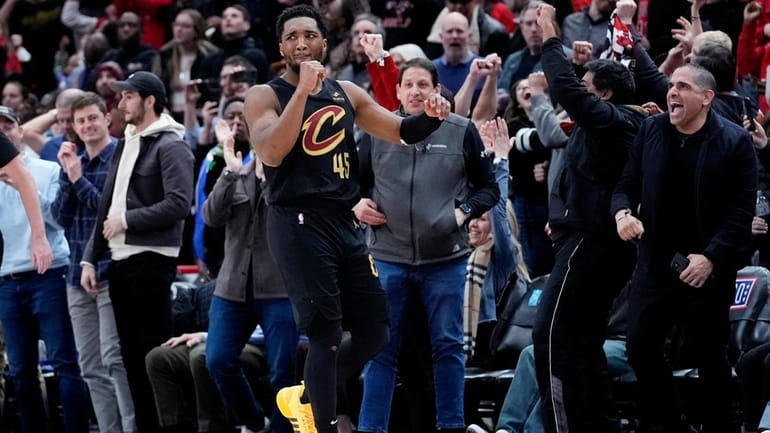 Cleveland Cavaliers guard Donovan Mitchell reacts after missing a basket...