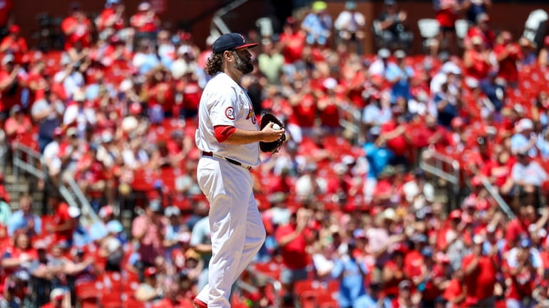 St. Louis Cardinals starting pitcher Lance Lynn pauses on the...