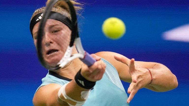 Karolina Muchova returns a shot to Sorana Cirstea during the quarterfinals of...