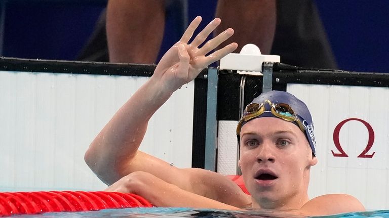 Leon Marchand of France, celebrates after winning the men's 200-meter...