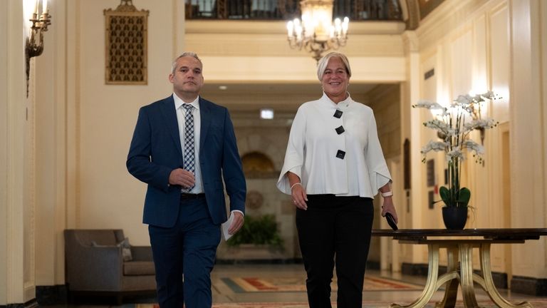 Fairmont Chateau Laurier General Manager Genevieve Dumas, right, speaks with...