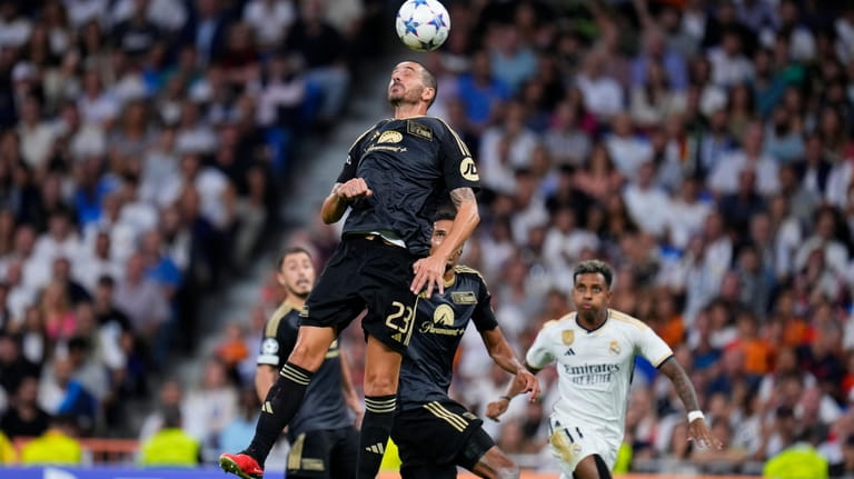 Union's Leonardo Bonucci heads the ball during the Champions League...