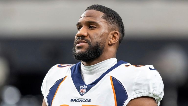 Denver Broncos cornerback Fabian Moreau (23) warms up before playing...