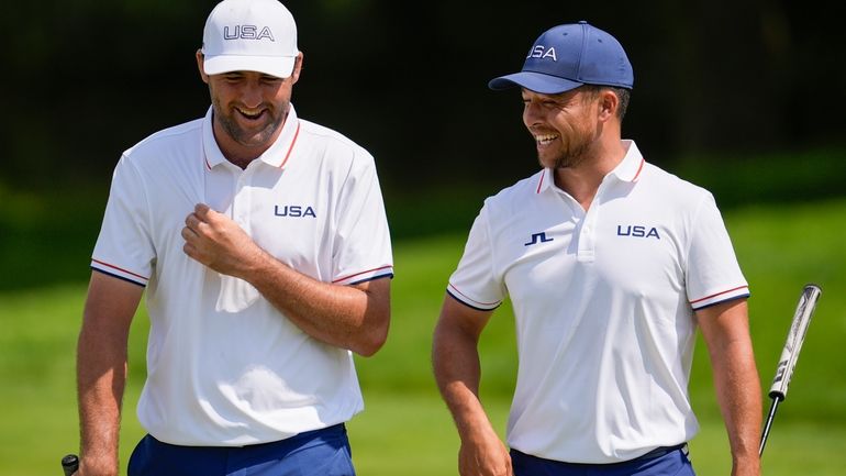 Scottie Scheffler, left, and Xander Schauffele, both of the United...