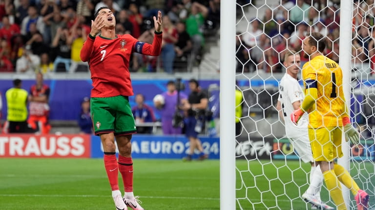 Portugal's Cristiano Ronaldo reacts after missing a scoring chance during...