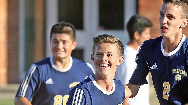 Massapequa's Ryan McMahon reacts after scoring game's second goal during...