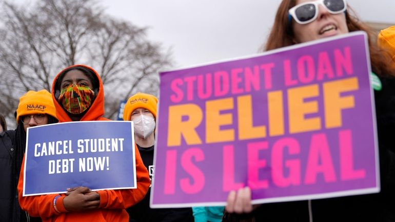 Student debt relief advocates gather outside the Supreme Court on...