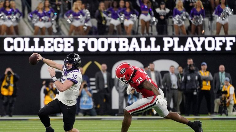 TCU quarterback Max Duggan (15) runs out of the pocket,...