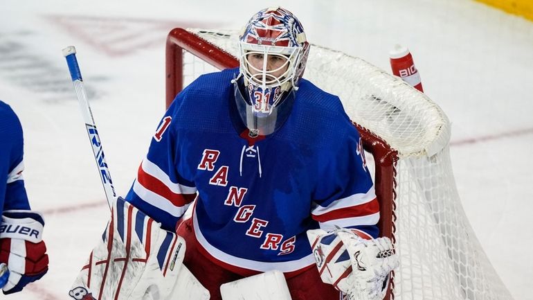 Rangers goaltender Igor Shesterkin protects his net during the second period...