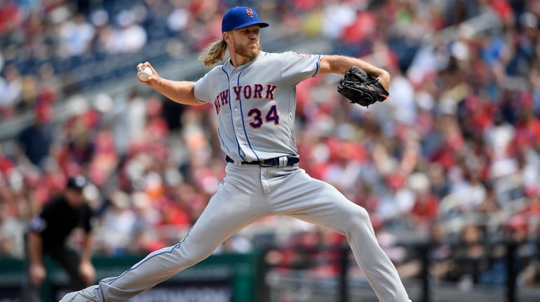 Mets starting pitcher Noah Syndergaard (34) delivers during the third...