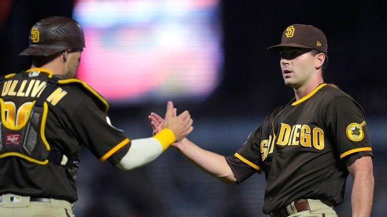 San Diego Padres catcher Brett Sullivan, left, celebrates with pitcher...