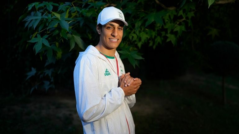 Algerian boxer Imane Khelif poses for a photo after an...