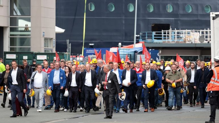 Federal Chancellor Olaf Scholz, front 4th from left, visits the...